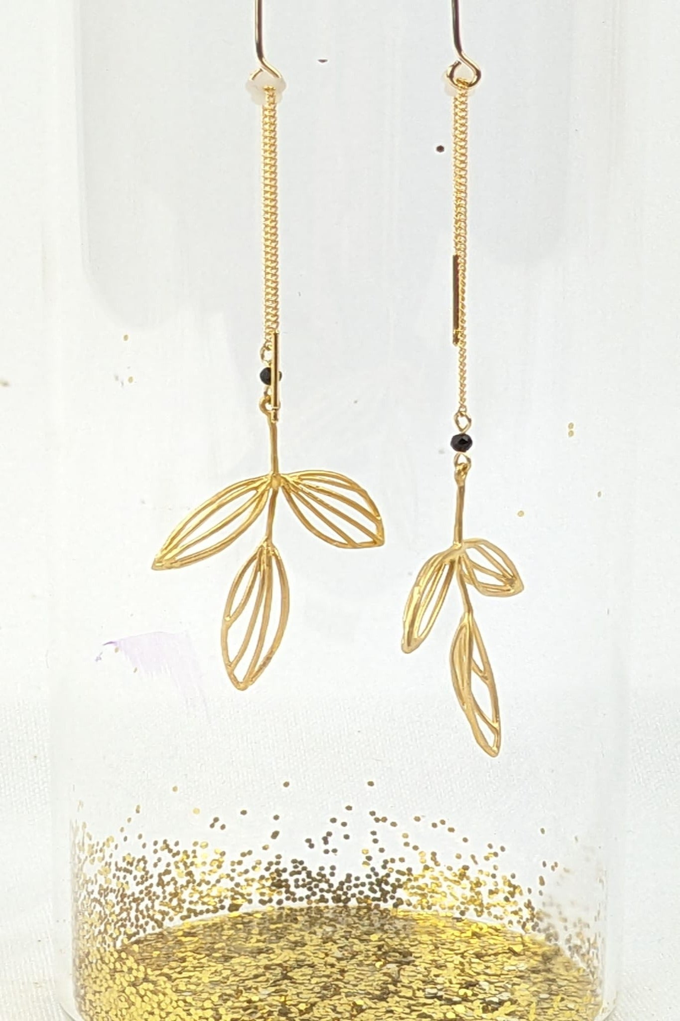Dangling golden poetic leaf threader earrings