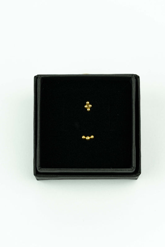 Dot inspired set of 2 goldplated stainless stud ideal for mix &amp; match.

Handpicked by our Stay Gold Antwerp atelier in the center of the city, just next to the cathedral of Antwerp.

Hypoallergenic

Giftwrapped in a beautiful Stay Gold Antwerp box.