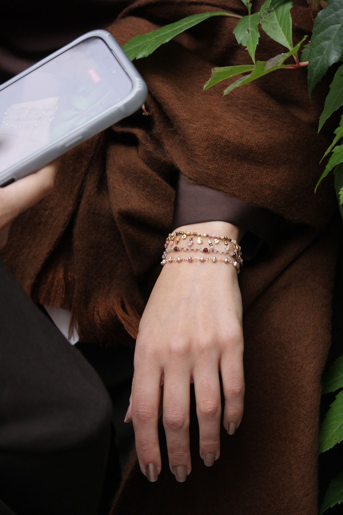 Natural pink jade and glowing moonstone bracelet featuring delicate dangling gemstone findings